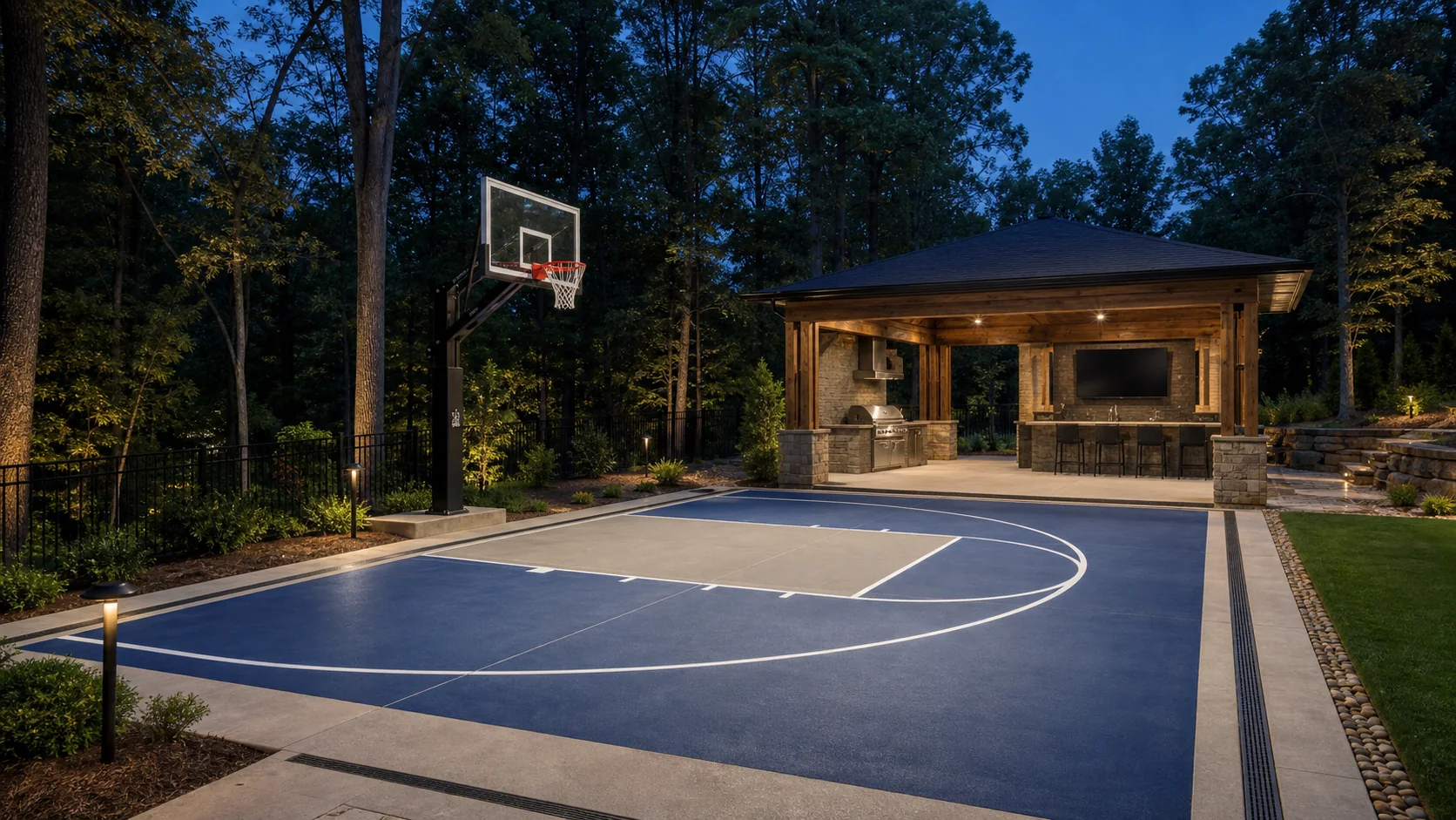 Residential basketball half court paired with a covered pergola gathering area