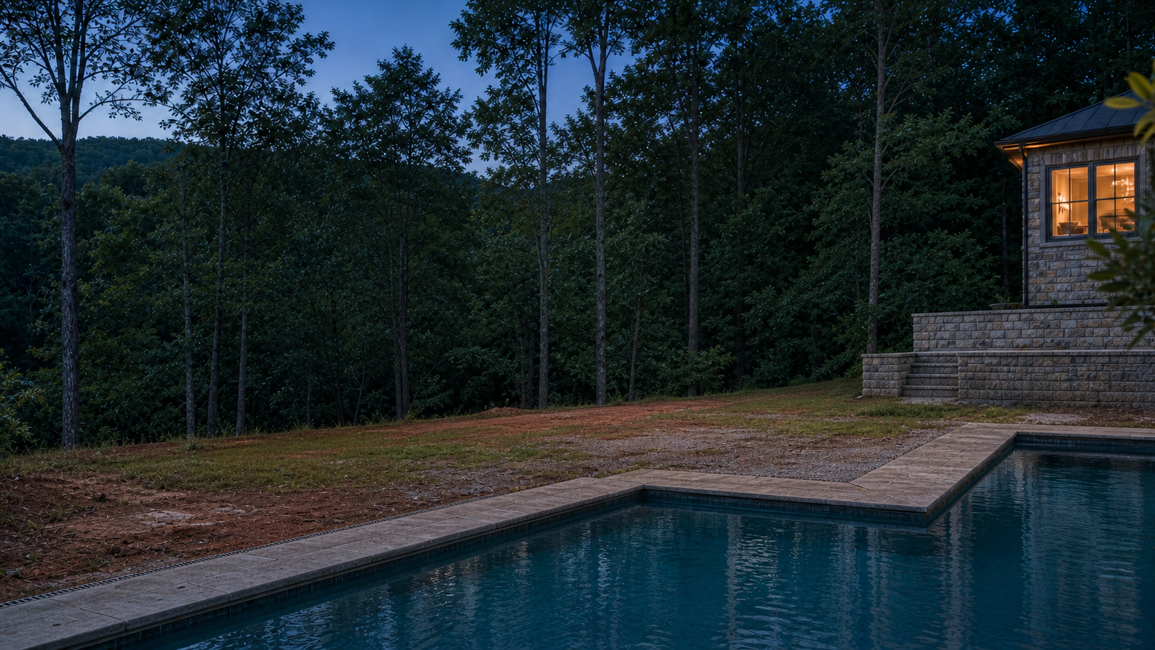 Open residential pool deck before a shaded outdoor-living addition