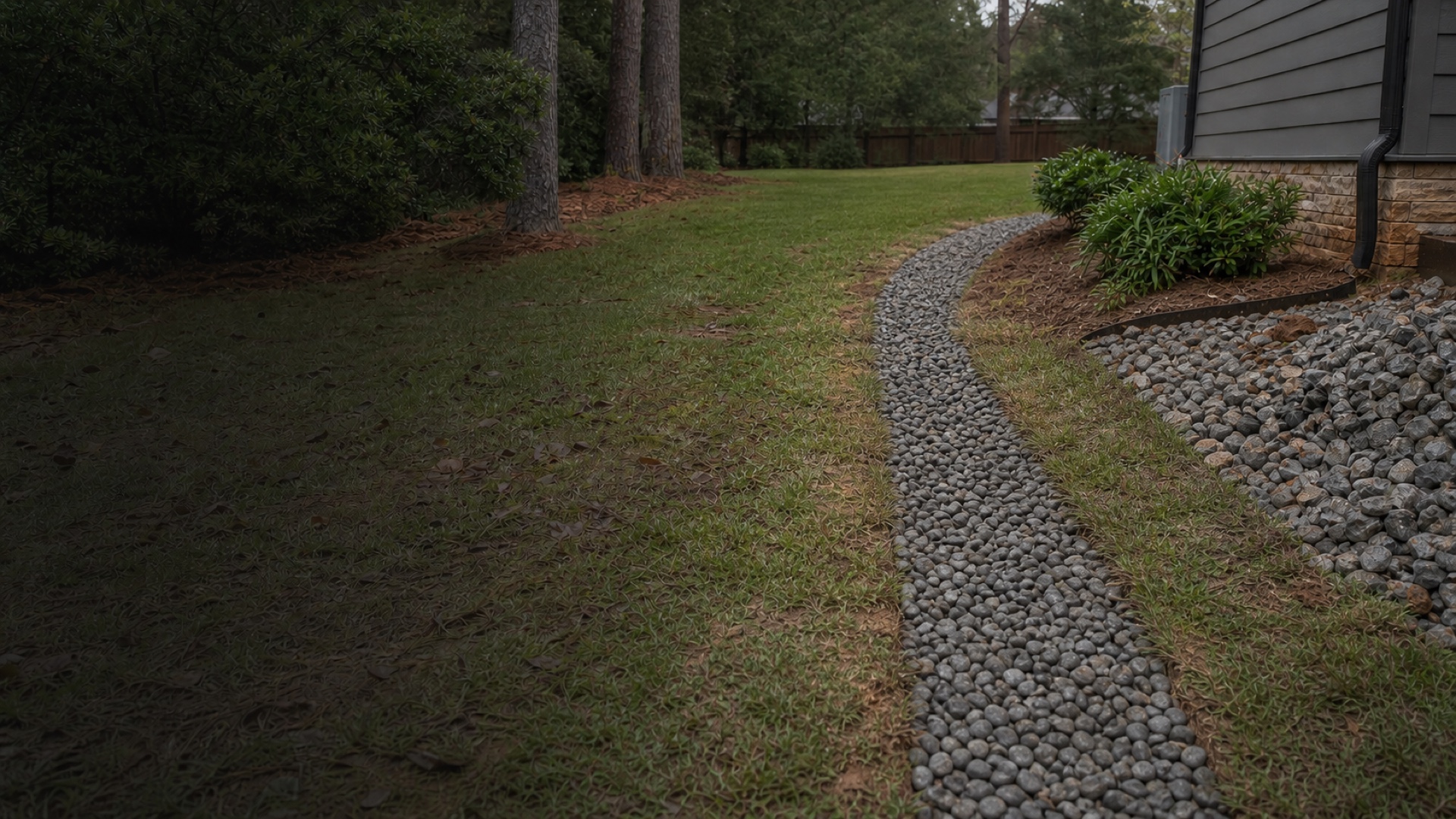 Residential yard after a French drain route has been neatly finished