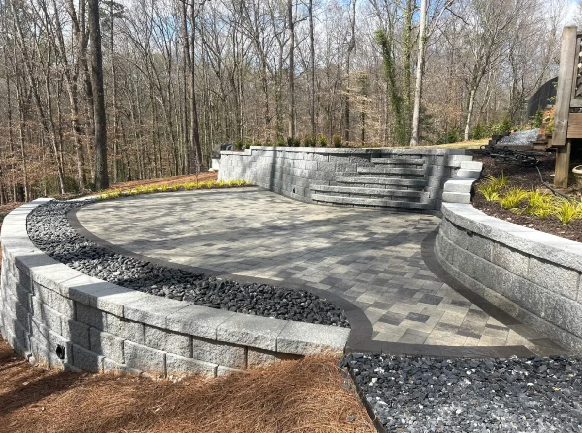 Cinder-block retaining wall, slate rock, edging, and custom pavers in Cumming, Georgia